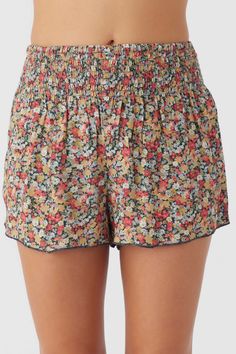 Cute and essential pull-on short that has an allover print design, smocked elastic waist and flowy fit. O'Neill Women's woven short 2.5" Inseam 13" Rise Smocked waistband Allover print 100% Viscose Beach Floral Print Stretch Shorts, Stretch Floral Print Shorts For Beach, Stretch Floral Print Beach Shorts, Casual Pajama Shorts With Elastic Waistband For Beach Season, Relaxed Fit Bottoms With All Over Print For Spring, Casual All Over Print Spring Bottoms, Elastic Waistband Shorts For Spring Vacation, Relaxed Fit Pull-on Beach Shorts, Trendy Beach Bottoms With Smocked Back