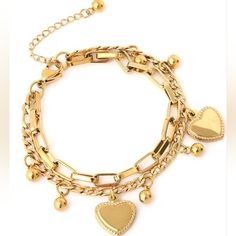 Gold Toned Link Bracelet With Heart Charms Gold Metal Bracelet With Heart Pendant, Trendy Metal Bracelets With Heart Charm, Trendy Gold Charm Bracelet With Heart Charm, Trendy Gold Heart Bracelet With Heart Charm, Trendy Metal Heart Bracelet For Valentine's Day, Gold Trendy Charm Bracelet With Heart Charm, Metal Bracelets With Heart Beads, Gold Heart Pendant Bracelet, Trendy Gold Heart Bracelet With Chain