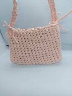 This lightweight crochet handbag in a soft pastel hue is the perfect blend of style and practicality. Handcrafted for comfort, it features a spacious interior to easily carry your essentials. Its airy design and gentle color make it ideal for casual outings or everyday use, adding a touch of elegance and charm to your look. Shoulder Bag Crochet, Handbag Crochet, Crochet Colorful, Crochet Handbag, Crochet Shoulder Bag, Pink Crossbody Bag, Pink Handbags, Crochet Handmade, Bag Crochet