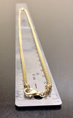 DeKara Designs Custom Made Metal- 14K Yellow Gold, .583. Measurements- 24 Inches Long, 3.00-3.10 MM Width. Beautiful handmade 14K yellow gold Franco chain/necklace. This chain is 3.00 mm thick, and is 24 inches in length. The look, feel, and touch of this necklace is amazing, and the diamond cut gives it an extra shine that is exceptionally beautiful. Can be worn by either an adult male or woman. Perfect on its own, or can be worn with a pendant as well. This price can't be beat! Diamond cut fin Gold Cuban Link Jewelry With Lobster Clasp, Gold Custom Pendant Necklace, Yellow Gold Cuban Link Jewelry With Lobster Clasp, Gold Oval Link Curb Chain Jewelry, Yellow Gold Plated Jewelry With Curb Chain, Gold-plated Yellow Gold Jewelry With Curb Chain, 14k Gold Curb Chain Pendant Necklace, Anniversary Cuban Link Necklace With Adjustable Chain, Classic Gold Curb Chain Jewelry