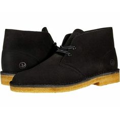 An international cult classic, the iconic men's desert boot from Clarks artisan was inspired by crepe-soled boots worn by british officers in world War ii. Crafted from natural materials including tumbled leather or suede for supreme comfort, its timeless styling and crepe outsole has remained unchanged for over 60 years. Size: 11.5.  Color: Black.  Gender: male.  Age Group: adult. Black Rugged Chukka Boots With Round Toe, Rugged Black Chukka Boots With Round Toe, Black Suede Plain Toe Chukka Boots, Casual Desert Boots With Round Toe For Streetwear, Casual Streetwear Desert Boots With Round Toe, Rugged Desert Boots With Rubber Sole And Round Toe, Suede Boots With Branded Insole For Streetwear, Classic Moc Toe Boots For Streetwear, Streetwear Moc Toe Boots With Rubber Sole