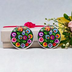 Our Silver Mexican Floral Stud Cabochon Earrings showcase the retro vintage style that is currently trending. These earrings feature a unique cabochon design with a flat underside and outwardly curved upper side, crafted with clear acrylic glass for an affordable option. The colorful and vibrant Mexican-inspired designs make these earrings a beautiful and thoughtful gift for any occasion. Show your loved one that it's the thought that counts, and that good intentions are more important than expe Retro Clip-on Earrings For Gift, Multicolor Vintage Earrings As Gift, Vintage Multicolor Earrings As Gift, Vintage Multicolor Earrings For Gifts, Colorful Retro Earrings For Gifts, Colorful Retro Earrings For Gift, Cabochon Earrings, Expensive Gifts, Good Intentions