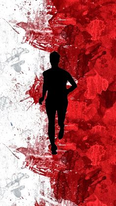 the silhouette of a person running in front of a red and white background