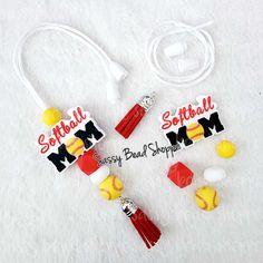 two softball mom necklaces on a white background