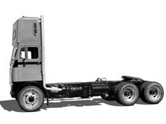 a black and white photo of a semi truck