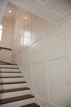 an empty staircase leading up to the second floor