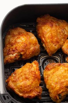 chicken wings cooking in an air fryer