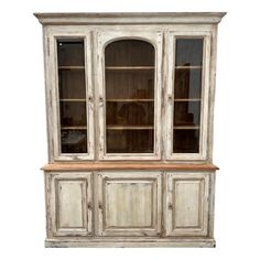 an old white china cabinet with glass doors and drawers on the front, against a white background