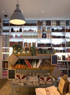 a store filled with lots of different types of food and drinks on shelves next to each other