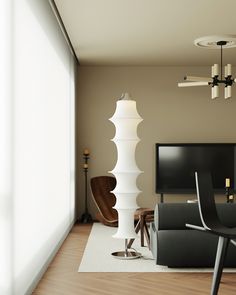 a living room filled with furniture and a flat screen tv on top of a wooden floor