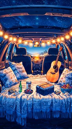 the interior of a car with an open trunk filled with luggage and guitars on it