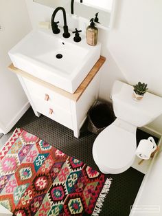 the bathroom is clean and ready to be used by someone in their home or business