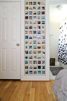 a door with pictures on it and a bed next to it in front of a doorway