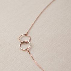 "A unique gift idea for a girl's weekend party favor! These friendship necklaces are great for your BFFs, sisters or bridesmaids. Available colors: gold, rose gold, gunmetal, silver Length: 16\" + 2\" extender; rings are 10mm round (choice of 2 rings or 3 rings) Materials: 14k gold filled, 14k rose gold filled or sterling silver (gunmetal is oxidized) All of our items are handmade and therefore each one is unique. Thank you for shopping with us! adorn512" Infinity Jewelry For Best Friend Valentine's Day Gift, Rose Gold Charm Necklace With Adjustable Chain For Wedding, Rose Gold Charm Necklaces For Bridesmaids, Rose Gold Jewelry With Adjustable Chain For Best Friend, Elegant Round Pendant Necklace For Best Friend, Infinity Necklace With Delicate Chain For Wedding, Adjustable Delicate Chain Jewelry For Bridesmaid Gift, Adjustable Delicate Chain Jewelry For Bridesmaid, Nickel Free Necklaces For Best Friend Gift