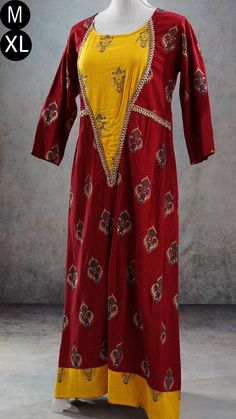 **Product color may have slight variations due to surrounding light** PRODUCT DETAILS This is a very beautiful maroon and yellow ethnic dress with gold print and Indian print throughout its body. It has gota patti detailing near its yoke and sleeves. It has three-quarter sleeves, and asymmetric hem. The Kurti has a slightly wider neck. It can be worn with a leggings or as a dress. Size & Fit Medium Chest: 38 inches Waist: 36 inches Back Shoulder: 15 inches Sleeve Length: 17 inches Armhole Round: Fitted Cotton Silk Palazzo Set With Long Sleeves, Fitted Long Sleeve Cotton Silk Palazzo Set, Designer Red Cotton Silk Dress, Fitted Yellow Palazzo Set With Printed Motifs, Wedding Dresses With Kalamkari Print, Long Sleeve Kurta With Kalamkari Print For Weddings, Long Sleeve Kalamkari Print Kurta For Wedding, Festive Cotton Silk Maxi Kurta, Festive Cotton Silk Maxi Length Kurta