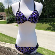 Purple Cheetah Slide Triangle Top With Black Wooden Hoops. Ruched Hipster Bottom Features Black Wooden Hoops At Hips. Size Small. New Without Tags Boutique Item. Adjustable Purple Swimwear For Beach, Adjustable Purple Swimwear For Swimming, Adjustable Purple Swimwear For Vacation, Fitted Purple Swimwear For Beach, Fitted Purple Swimwear For Poolside, Fitted Purple Swimwear For Vacation, Fitted Purple Swimwear For Beach Season, Purple Stretch Swimwear For Festival, Adjustable Purple Beachwear Swimwear