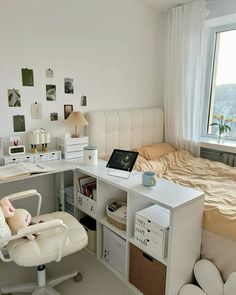 a white desk and chair in a small room