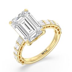 a yellow gold ring with an emerald cut diamond