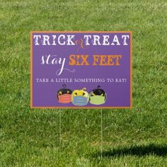 a sign that says trick or treat stay six feet take a little something to eat