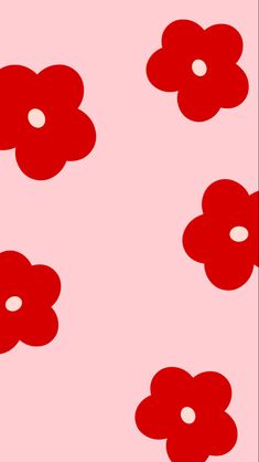 red flowers on a pink background with white circles in the center and bottom half of each flower