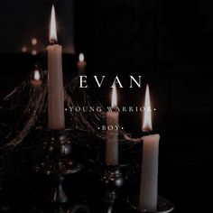 several lit candles sitting on top of a table with the words evan young warrior boy