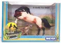 a toy horse and her foal are in a box with the label below it