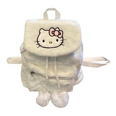 This New Adorable Backpack Features The A Hello Kitty Character . It Is Made Of Soft White Fuzzy Plush Material And Has Pom-Poms And Hello Kitty Embroidered Accent On The Front . The Bag Has A Magnetic Closure And Adjustable Straps For A Comfortable Fit. It Also Has An Outer Pocket For Added Convenience. The Backpack Measures 10.2 X 5.5 X 9.8 Inches And Is Perfect For Kids Who Love Hello Kitty. Cute White Backpack With Cat Design, Trendy Hello Kitty Backpack For School, Cute White Cat Design Backpack, Trendy White Backpack With Cat Design, Playful White Backpack, Hello Kitty White Backpack For School, White Backpack With Cat Design, White Student Bag With Cat Design, White School Backpack With Cat Design