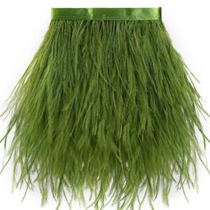 a green purse with long, shaggy grass on the front and bottom half of it