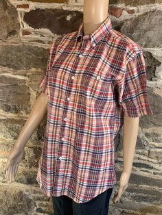 "Vintage, 1970s, Sears Contemporary plaid oxford t-shirt. Well worn appearance with a couple small stains.  100% Cotton Adult medium  Length, 30\" Underarm to underarm, 20\"" Casual Plaid Cotton T-shirt, Casual Plaid Short Sleeve Camp Shirt, Classic Short Sleeve Plaid Top, Classic Plaid Cotton Short Sleeve Shirt, Classic Cotton Short Sleeve Plaid Shirt, Vintage Plaid Cotton Shirt, Retro Plaid Short Sleeve Shirt, Retro Short Sleeve Plaid Shirt, Casual Plaid Short Sleeve T-shirt