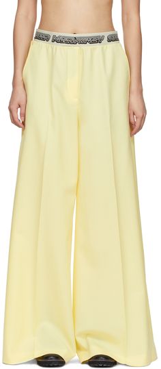 Wide-leg cotton-blend canvas trousers in yellow. Logo pattern woven at elasticized waistband. · Mid-rise · Two-pocket styling · Dropped inseam Made from cruelty-free, non-animal materials. Supplier color: Sherbet Yellow | Stella McCartney Yellow Logo Tape Trousers Chic Yellow Cotton Pants, Yellow Wide-leg Workwear Bottoms, Yellow Wide-leg Workwear Pants, Yellow Wide-leg Pants For Work, Yellow Wide Leg Pants For Spring Workwear, Spring Yellow Wide Leg Pants For Workwear, Yellow High-waisted Wide Leg Pants For Work, Chic Yellow Cotton Wide Leg Pants, Yellow Wide Leg Workwear Bottoms