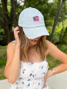 "This 4th of July, top off your Independence Day ensemble with a stylish baseball hat, complete with a mini American flag embroidery. Show your independence in true patriotic style! Sample shown in Light Denim Light Denim is the only distressed cap. Features for Solid Colors: 100% cotton, garment-washed twill Unstructured, six-panels, low-profile Pre-curved visor Tri-glide buckle closure Features for Distressed Cap: Vintage Distressed Washed Style Lightweight, Durable, Smooth 6-Eyelets, 6-panel, Unstructured, Low-Profile Adjustable Antiqued Brass Buckle Back Closure Brim With Vintage Torn And Stitched Décor Material : Cotton Length/Height/Wide : 11.0\" / 6.0\" / 7.5\" Brim Length: 2.75\" All sales are final due to customization of product. Will ship USPS or UPS unless requested otherwise. Patriotic Baseball Cap One Size Fits Most, Memorial Day Cap Hat, One Size Fits Most, 4th Of July Trucker Baseball Cap, 4th Of July Baseball Cap, One Size Fits Most, White Trucker/basbeall Cap For 4th Of July, Flag Embroidery, Patriotic Fashion, Light Denim, Trucker Cap