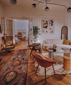 a living room filled with lots of furniture and decor