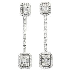 Introducing our 18KT White Gold Baguette Illusion Halo Natural Diamonds Dangler Drop Earrings, a stunning and unique piece that will take your breath away. These earrings feature a combination of natural baguette and round brilliant set in a with a halo design, creating an extraordinary sparkle that will catch the eye of everyone around you. Made with 18kt white gold and natural diamonds, these earrings are durable and long-lasting, just like true love. They are also designed with a dangler drop style, making them a versatile and elegant choice. These earrings are perfect for any occasion; whether you're attending a fancy gala or an intimate dinner with your loved one, they will add a touch of elegance and romance to any outfit. Gift these earrings to someone you love, or treat yourself to Diamond Danglers, Art Deco Pendant Necklace, Dangler Earrings, Halo Design, Gold Cocktail, Diamond Drops, Color Dorado, Estate Jewelry, San Valentino