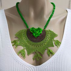 Ethnıc Jewelry,Women Necklace ,Tribal Jewelry,Green flower neclace Traditional Turkish Needle Lace Necklace,Green beaded necklace Crochet Lace Jewelry,Handmade Needle Lace Jewelry,Ethnic  LaceNecklace,Needle Lace Pendant,Oya Handcrafted Turkish Handmade Needle Lace Necklace Every piece is designed and handmade with love by me. For this listing; The length of the chain is 55 cm The width of the pendant is 12 cm The length of the pendant is 8cm I hope you like it too Thanks for looking at my handm Green Bohemian Choker For Festivals, Green Bohemian Choker As A Gift, Bohemian Green Beaded Choker Necklace, Green Bohemian Beaded Choker Necklace, Bohemian Green Choker As A Gift, Bohemian Green Choker As Gift, Green Bohemian Choker For Gifts, Bohemian Crochet Jewelry With Round Beads, Handmade Green Bohemian Choker