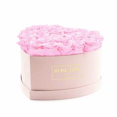 a rose box with pink roses in it