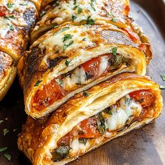 several different types of food are stacked on a wooden platter and ready to be eaten