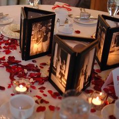 three candles are sitting on a table with rose petals around it and two pictures in the center