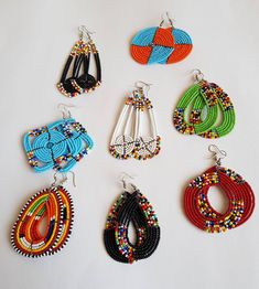 This listing is for ALL 8 pairs. The earrings are 100% handmade using original fine beads. Colorful and bright colors. ^^These earrings ships through dhl express. Buy multiple items and pay shipping for ONE item ONLY. Dangle Beaded Earrings For Gifts, Festival Jewelry With Round Beads And Ear Wire, Adjustable Assorted Jewelry, Traditional Assorted Jewelry As A Gift, Traditional Assorted Jewelry For Gift, Multicolor Round Beads Earrings, Assorted Jewelry Making Supplies, African Jewelry Earrings, African Wedding Jewelry