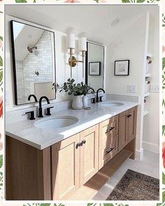 a bathroom with two sinks and mirrors on the wall above it is decorated with flowers