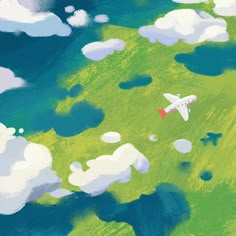 an airplane is flying in the sky over some green grass and clouds with blue water