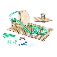 a set of wooden toys including a ferris wheel and various pieces to make it look like an amusement park