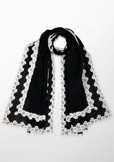 Indulge in the timeless allure of this gracefully hand crafted scarf. Created from a very light and airy linen and modal blend, this black scarf is emboldened by a contrasting double white floral lace border. The intricate lacework, reminiscent of blooming petals, adds a touch of romance to the scarf's design, creating a captivating visual interplay. This versatile accessory effortlessly transitions from casual to formal, providing a graceful complement to any ensemble. Elegant Shawl Scarf With Lace Trim, Elegant Lace Trim Shawl Scarf, Elegant Black Shawl Dupatta, Elegant Lace Work Dupatta For Spring, Elegant Black Dupatta, Black Scarf, Lace Border, Scarf Design, Black Linen