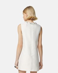 Crystal Duchesse Mini Dress White | VERSACE US Luxury Sleeveless Mini Dress For Wedding, Silk Party Dress With Embroidered Neckline, Luxury Silk Sleeveless Dress, Elegant White Silk Sleeveless Dress, Luxury Sleeveless Silk Mini Dress, Luxury Silk Sleeveless Mini Dress, Chic Sleeveless Dresses With Pearl Embroidery, Elegant Silk Dress With Embroidered Neckline, Embellished Sleeveless Satin Dress