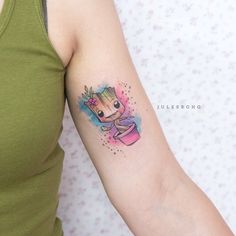 a woman's arm with a small tattoo of a baby groote on it