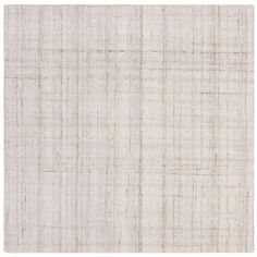 an area rug with white and beige colors