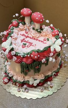 a decorated cake sitting on top of a table