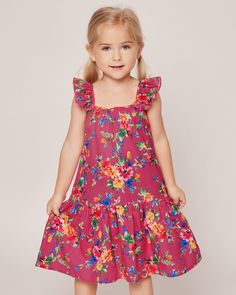 A celebration of summer's playful spirit. Vibrant blooms in hues of yellow, red, blue, and green dance on a sizzling hot pink canvas, exuding a sense of fun and joy. Embrace the lively energy of the summer season with this playful print, perfect for adding a bold splash of color to your sleepwear collection. The Celeste Lounge Dress boasts a lovely flutter at the shoulder and a comfortable a-line midi-length silhouette. A pretty gathered tier at the hem is our nod to your favorite summer sun dre Playful Floral Spring Dress, Playful Floral Sundress For Summer, Playful Floral Print Sundress For Summer, Playful Floral Print Dress For Garden Party, Vibrant Multicolor Print Summer Dress, Pink Sundress For Playtime In Summer, Playful Floral Print Dress For Vacation, Playful Sundress For Summer Garden Party, Playful Sundress For Garden Party In Summer