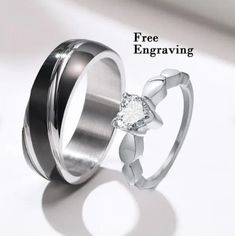 two wedding rings with the words free engraving on each side and a diamond in the middle