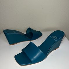 New Without Box Blue Round Toe Wedge Sandals For Formal Occasions, Blue Formal Wedge Sandals With Round Toe, Blue Synthetic Wedge Sandals With Block Heel, Blue Wedge Heel Sandals With 4-inch Heel, Blue Wedge Sandals For Summer Formal Events, Blue Wedge Sandals For Formal Summer Events, Elegant Blue Wedge Sandals With Round Toe, Elegant Blue Synthetic Wedge Sandals, Blue Leather Wedge Heel Sandals