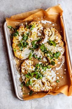 an overhead view of some food on a tray with grated parmesan cheese